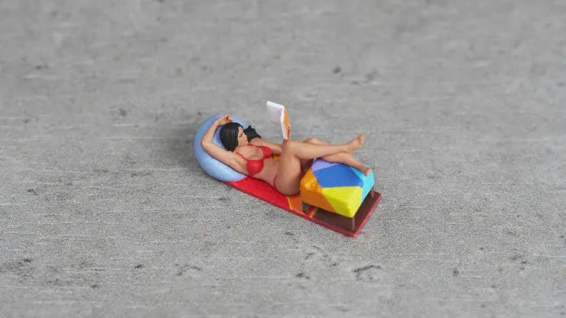 Girl lying down reading a book figurine handpaint high detail 1:18 to HO scale