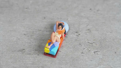 Girl lying down reading a book figurine handpaint high detail 1:18 to HO scale